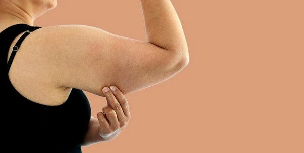 Toning Bingo Wings: Your Ultimate Guide to Sculpting Sleek Arms at the Gym 1 Woman doing push-ups for arm strength Braintree