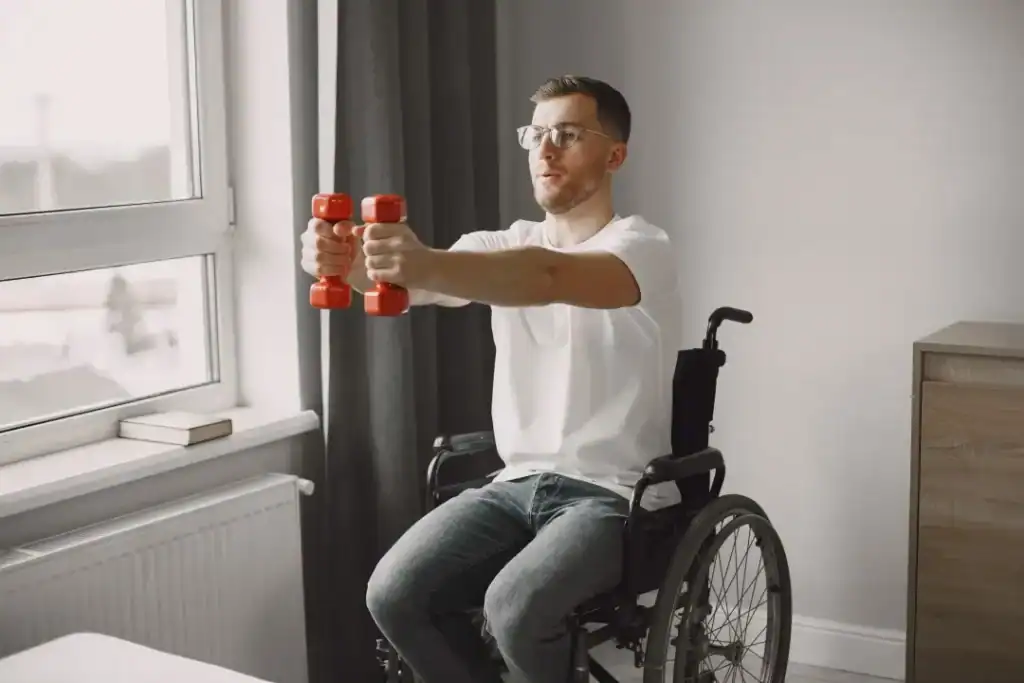 Empowering Weight Loss: A Comprehensive Guide for Individuals with Disabilities 1 Image of man doing exercise in his wheelchair to aid weight loss Braintree