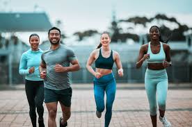 Sculpting Sleek Arms: The Essential Role of Cardio in Toning Without Bulking Up 3 image of people running to incorporate cardio Braintree exercise into their life to help tone arms and body.